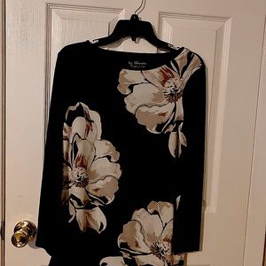 Black with large floral look lightly worn. Can be casual or dressy!